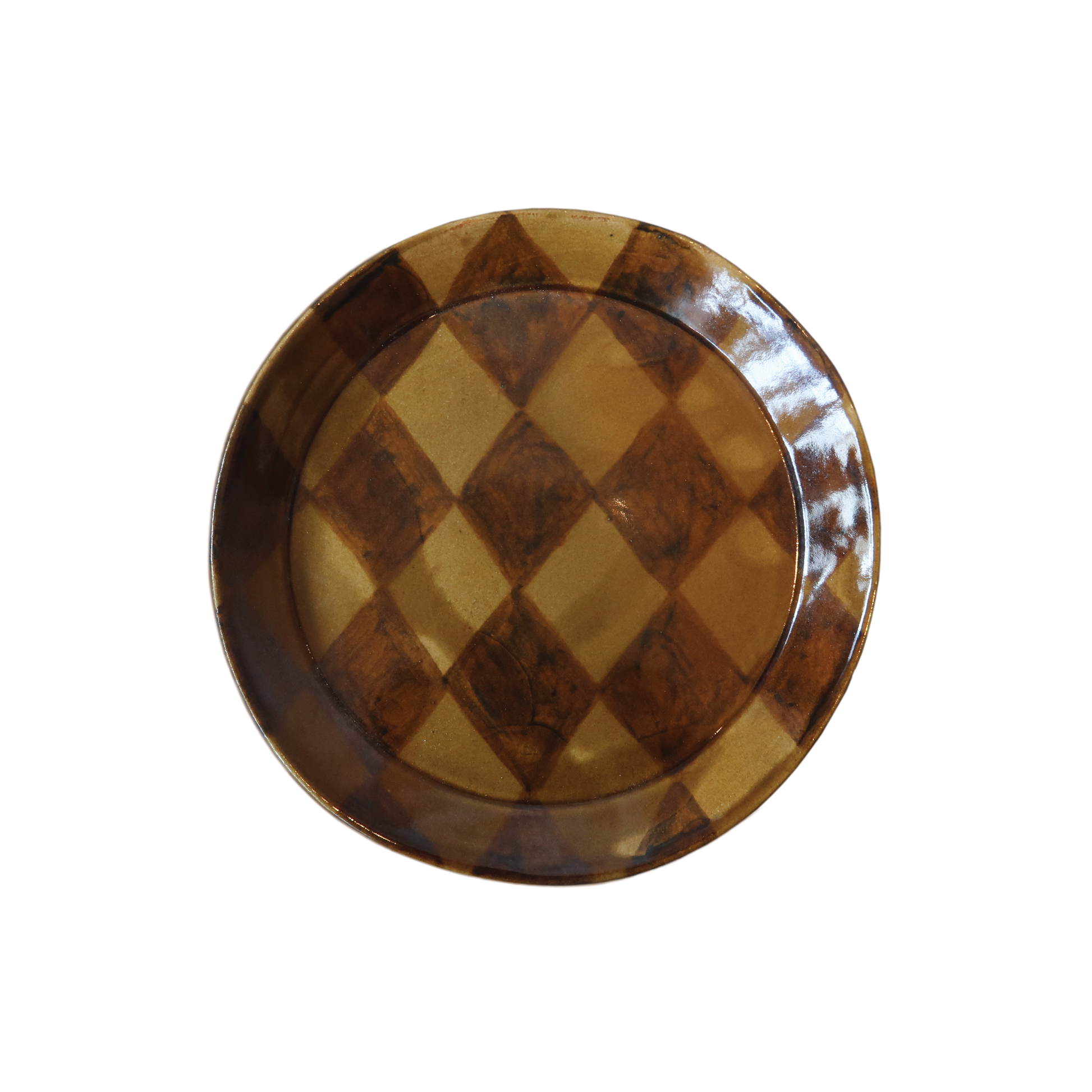 Stoneware plate, formed on a mould and painted by hand.  Fired once to 1000 degrees celsius, then signed, waxed, and dipped into a homemade glossy honey glaze. A harlequin pattern is painted by hand on top of the glaze. Once dry the piece is ready for its final 1230 degree firing.  Approximately:   19cm diameter    Paige Mitchell, Handmade Ceramics.